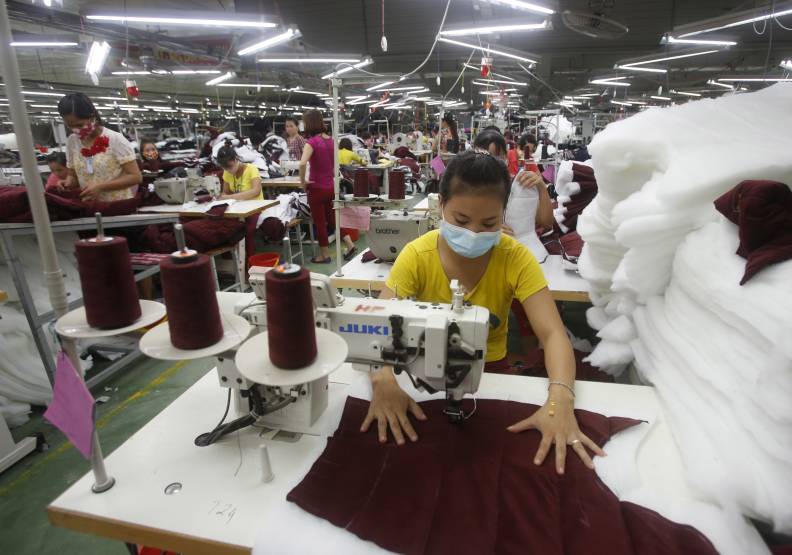 越南新冠疫情爆炸、大規模封城，國際知名品牌代工業面臨危機！（圖為昔日越南製造業榮景）達志影像提供